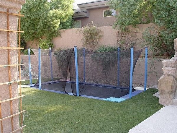 trampoline with safety net garden wall patio playground ideas 