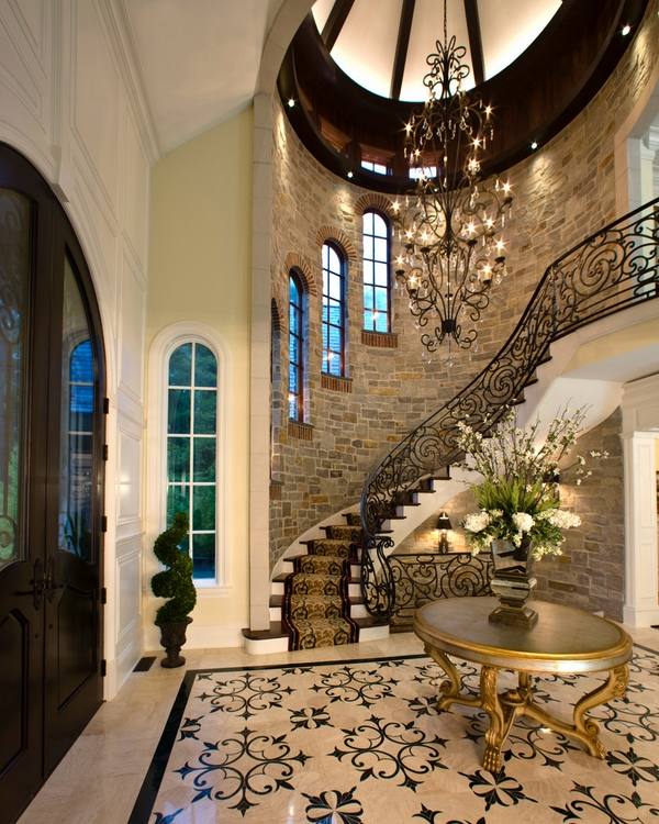 wrought iron stair railing house entry arched windows 