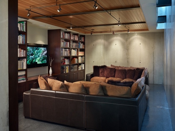 exposed basement ceiling home theater industrial decor terrazzo flooring 