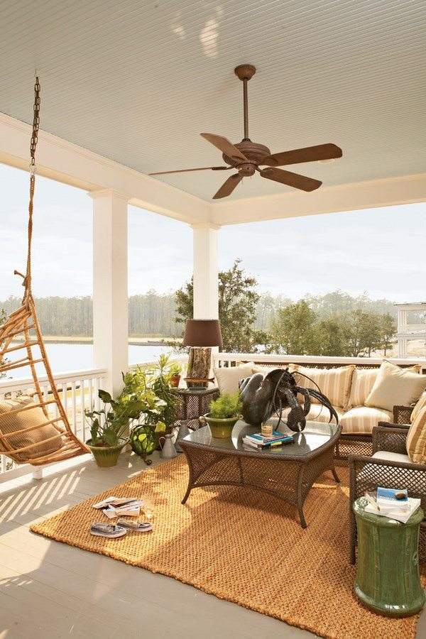porch-flooring-ideas-area rug ceiling fan hanging chair 