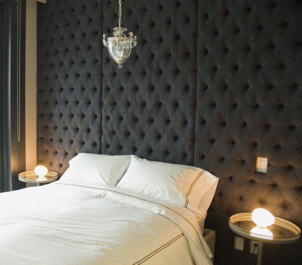 how-to-soundproof-a-bedroom-black tufted wall panels