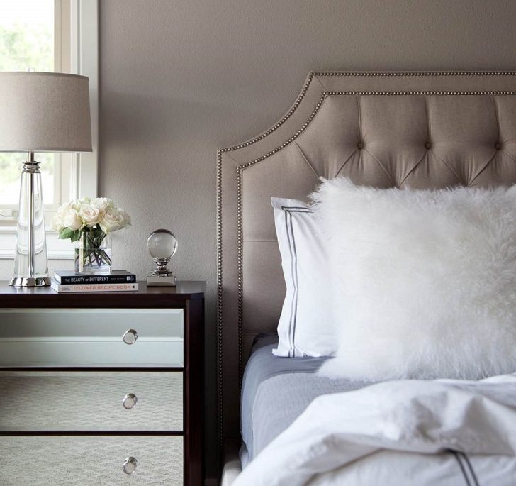 Taupe bedroom wall color and tufted bed headboard