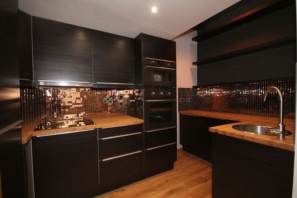 amazing kitchens black cabinets copper backsplash