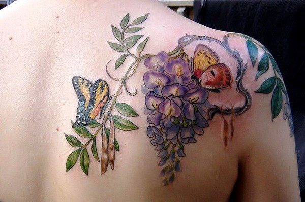 butterfly and flower tattoo on the back of the shoulder
