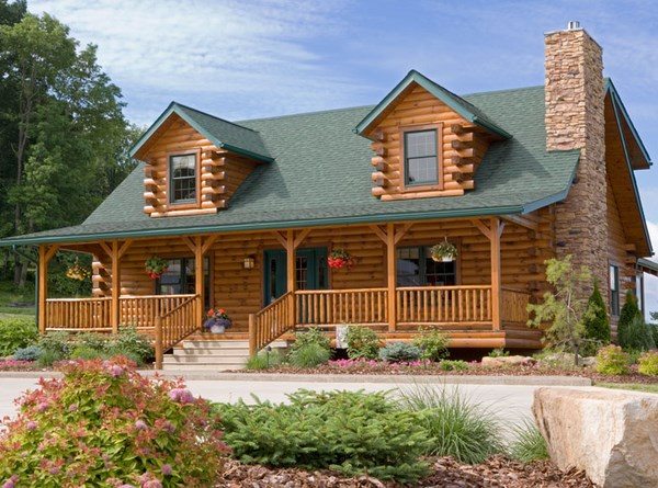 log cabin homes exterior front porch flower beds