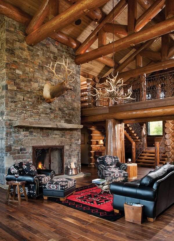 log house rustic living room stone fireplace black leather sofa