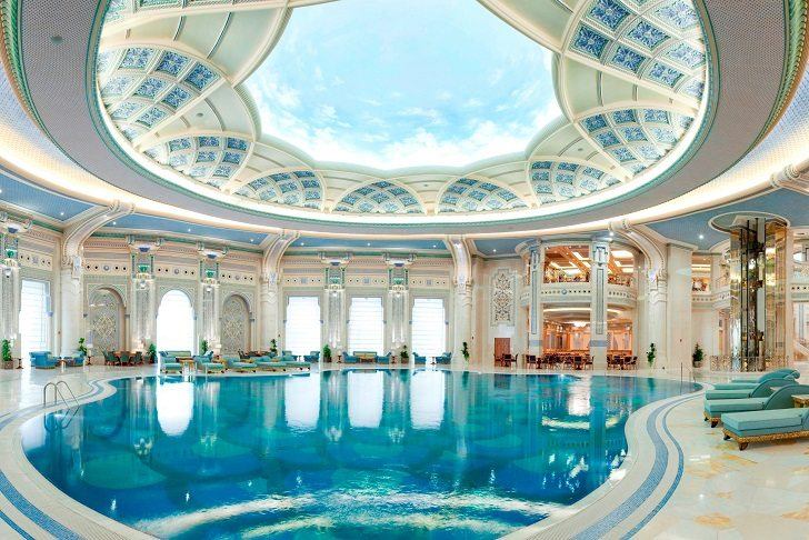 luxury indoor pool design with round ceiling