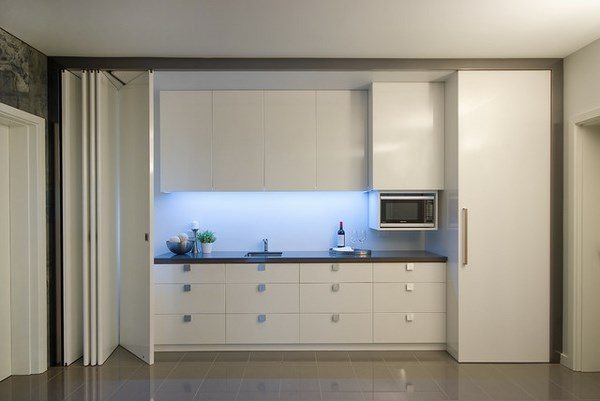 modern white kitchenette LED lighting and bifold doors