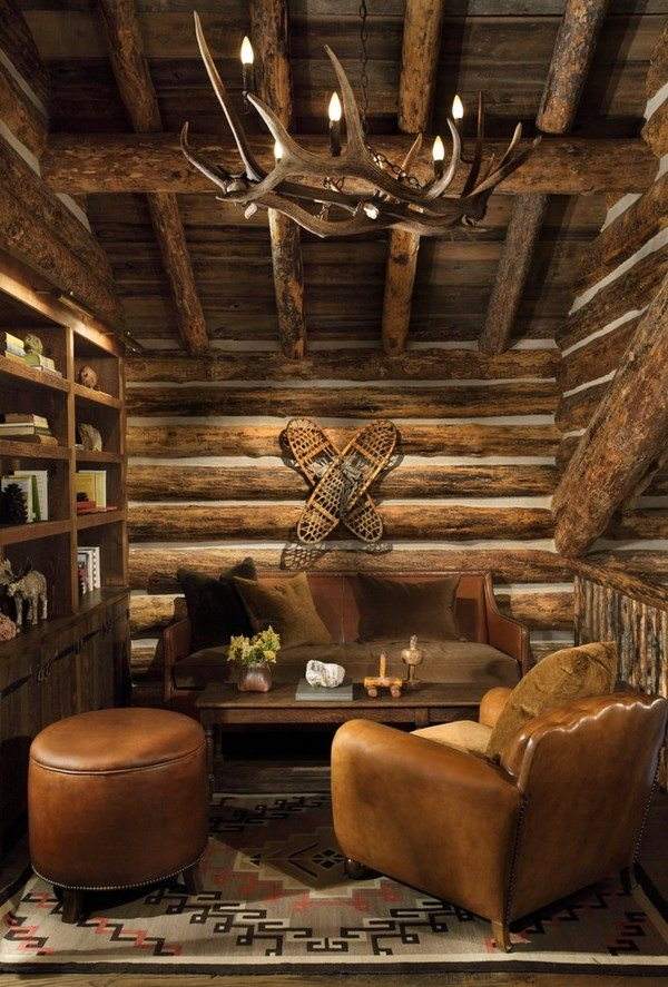 rustic family room antler chandelier leather armchair