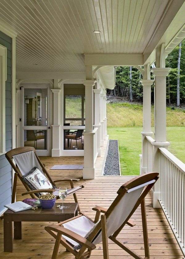 small veranda with railings chairs coffee table