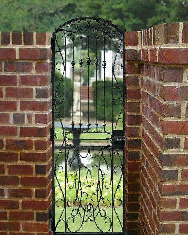 wrought iron gate brick wall garden design ideas