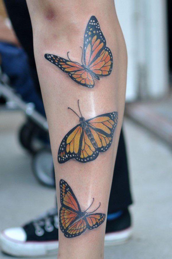 yellow butterfly leg tattoo