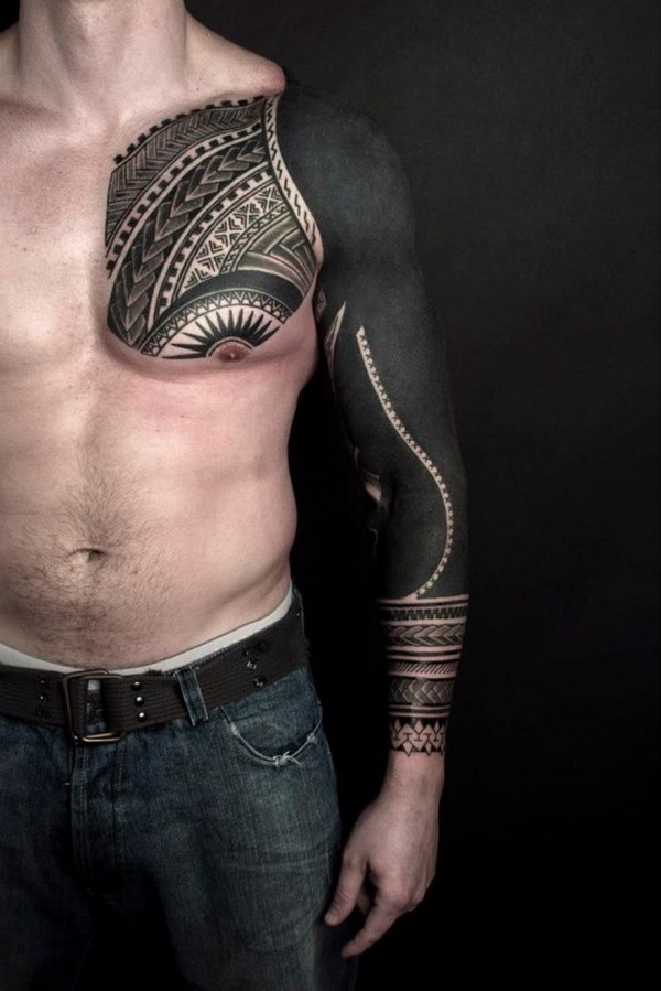 Blackwork tattoo style chest arm design