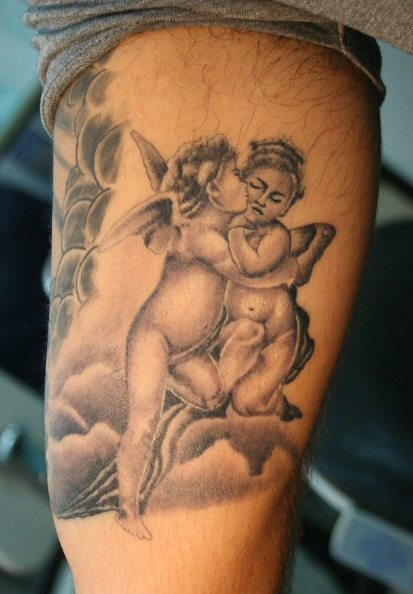 black and white cherub couple tattoo on arm
