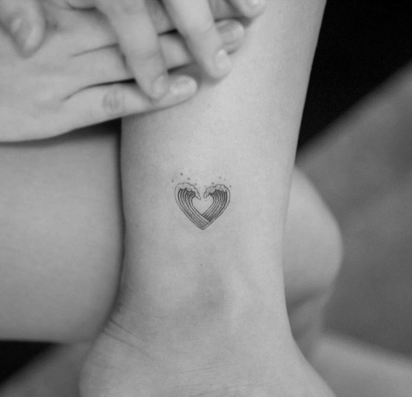 discreet waves heart tattoo on ankle