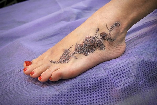 elegant tattoo on foot for women
