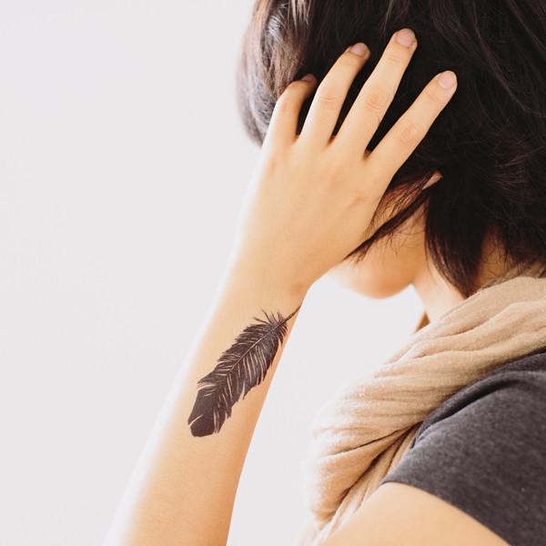 feather on forearm tattoo ideas for women