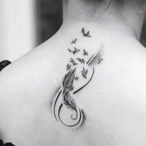 neck tattoo with feather and birds