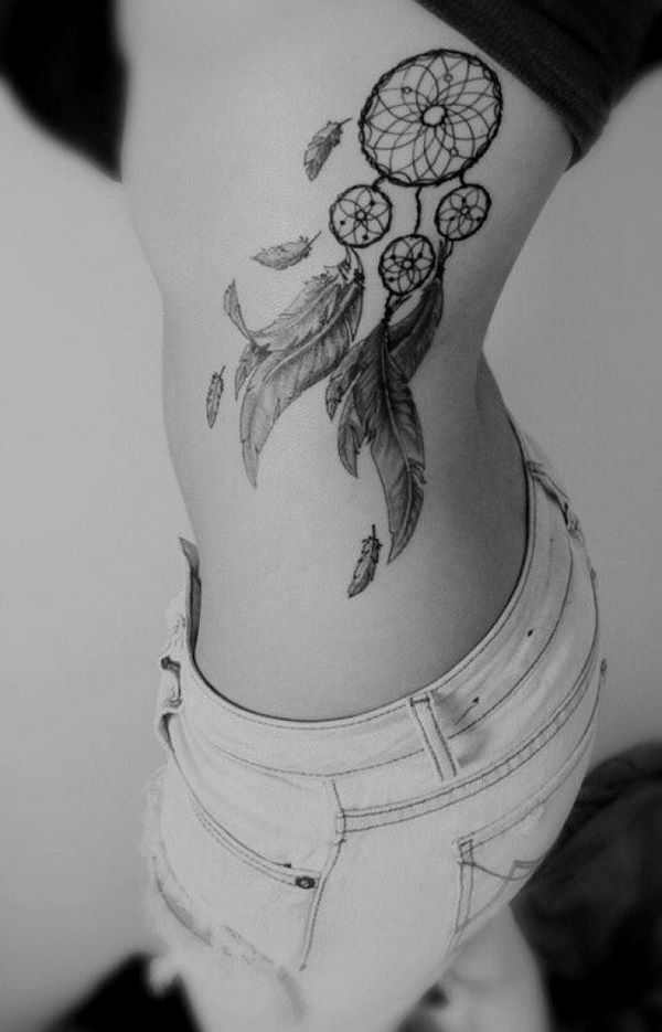 rib tattoos girl feathers