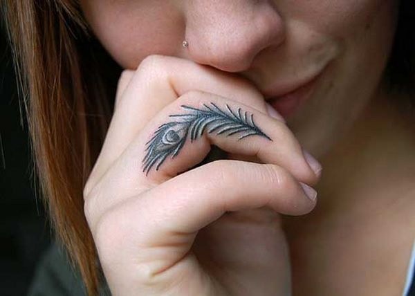 small feather finger tattoo peacock