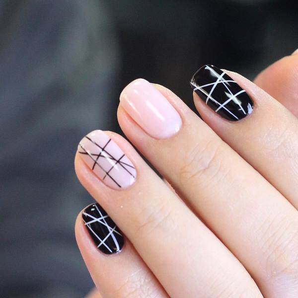 pink black nail design with geometric pattern