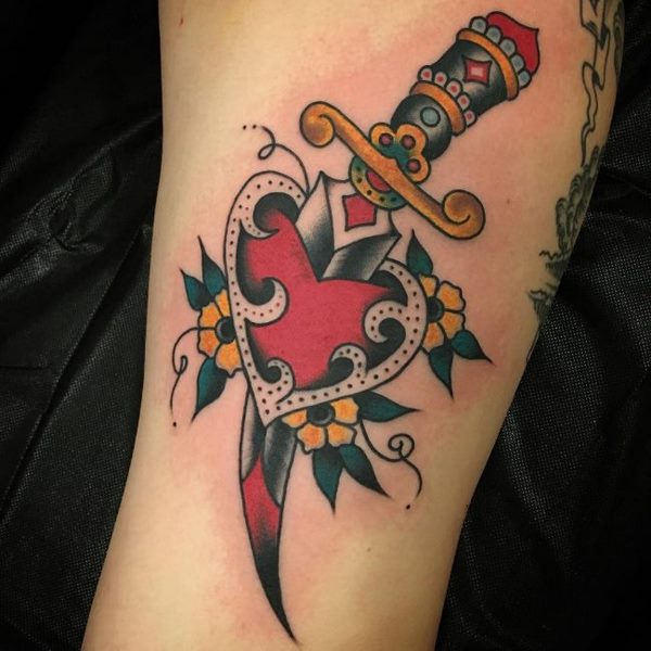 classic heart and dagger tattoo design
