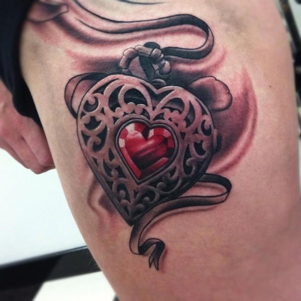 heart and locket thigh tattoo