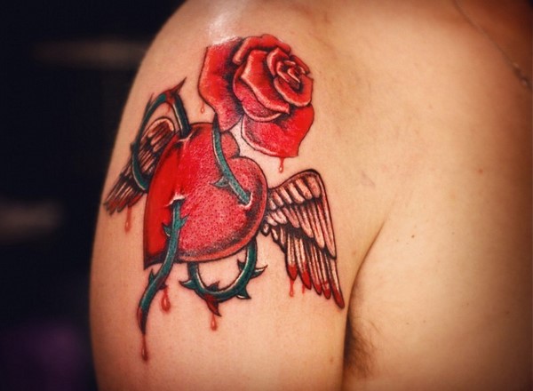 heart tattoo with rose thorns and wings