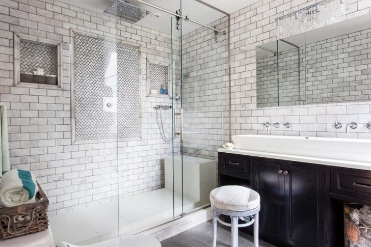moswern walk in shower with subway tile and glass doors