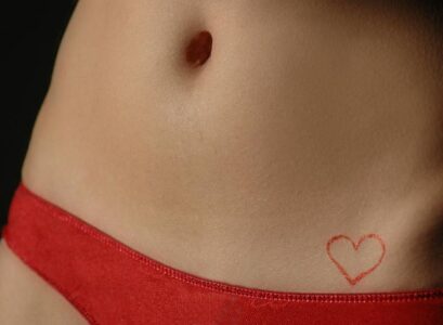 small-red-heart-tatoo-on-hip