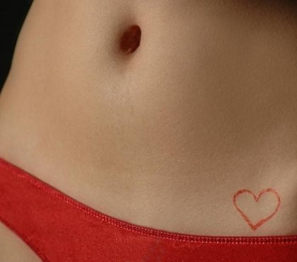 small-red-heart-tatoo-on-hip