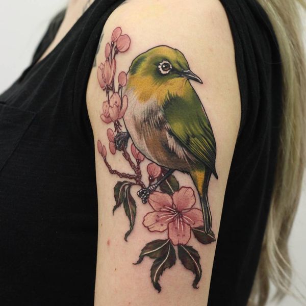 Beautiful cherry blossom and bird tattoo on shoulder