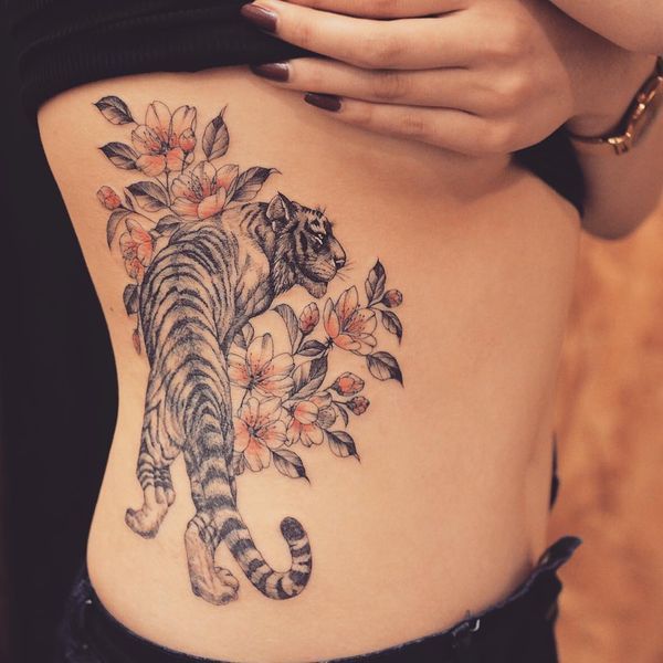 Japanese sakura and tiger tattoo design for women