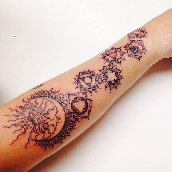 Spiritual sun tattoo on arm meaning symbols