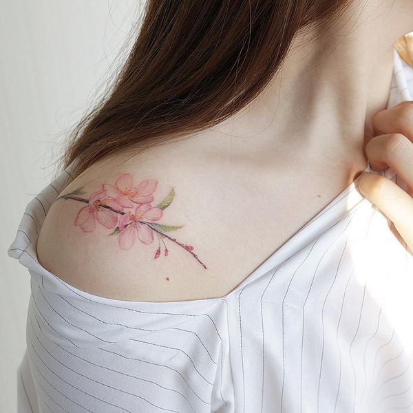 amazing cherry blossom tattoo on the shoulder