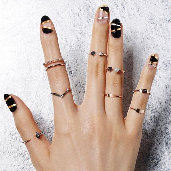 black and gold negative space nail design ideas