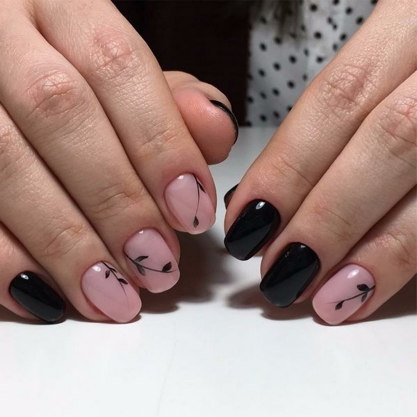 black and pink manicure with minimalist flowers
