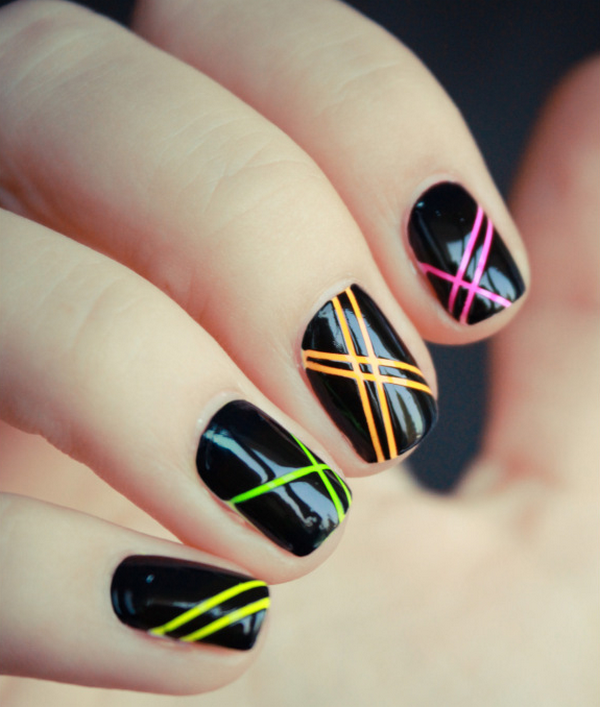 black manicure with neon geometric patterns