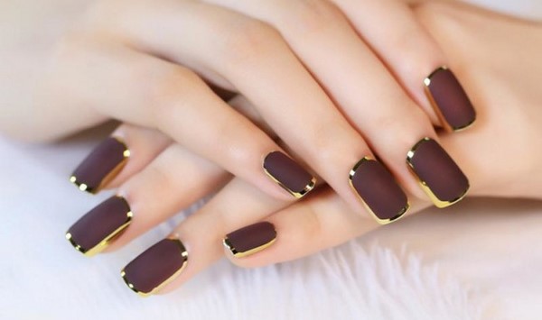 brown manicure gold accents moon nails