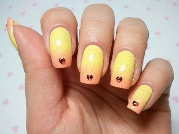gradient yellow nail art with heart shaped rhinestones