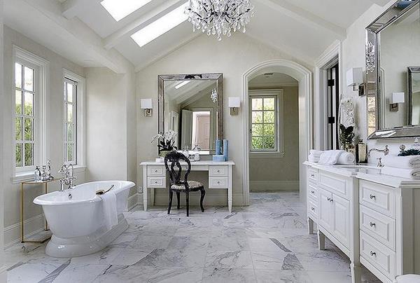 master bathroom with vaulted ceiling skylights freestanding tub vanity table