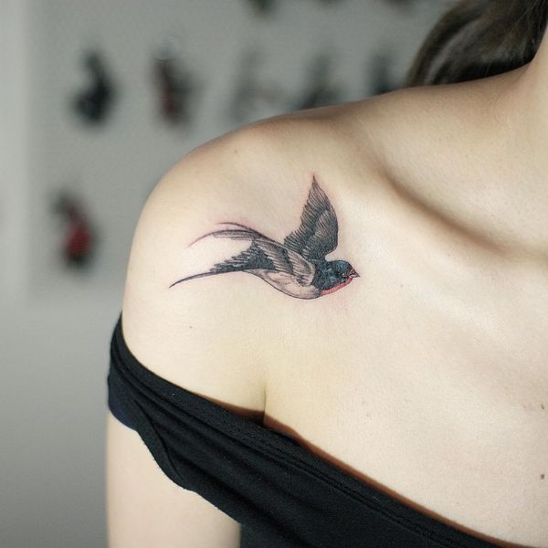 small bird tattoo on shoulder for women