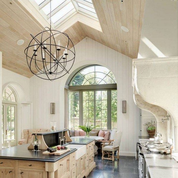 vaulted ceiling with skylights large chandelier kitchen lighting