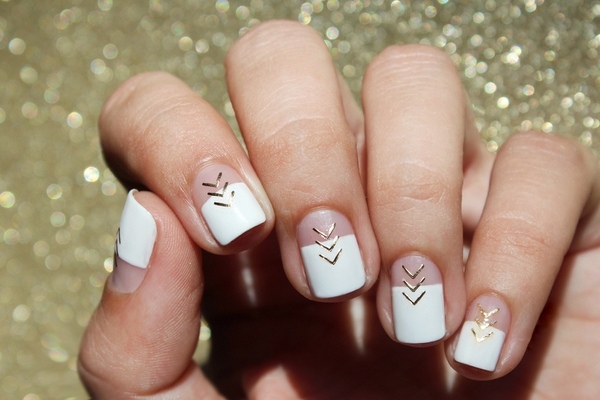 white and gold negative space nails