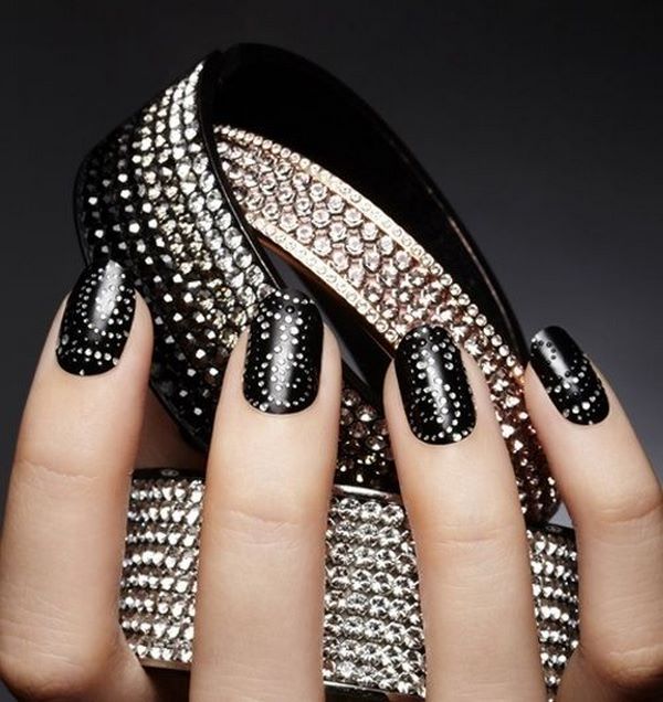 black nail art with crystal decorations