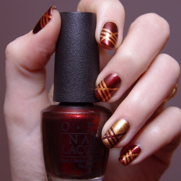 dream nails burgundy and gold nail design geometric pattern