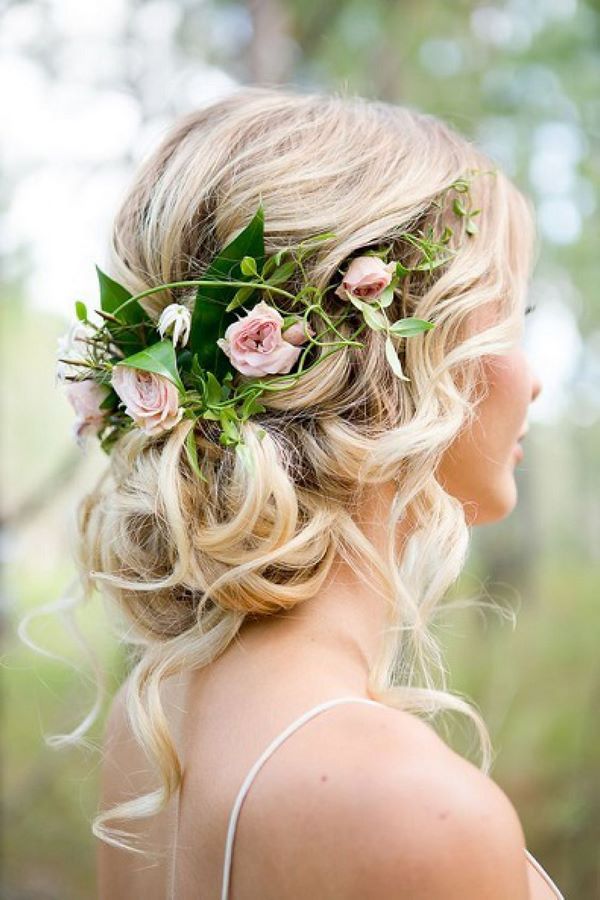 romantic hairstyles for bridesmads low bun with flowers