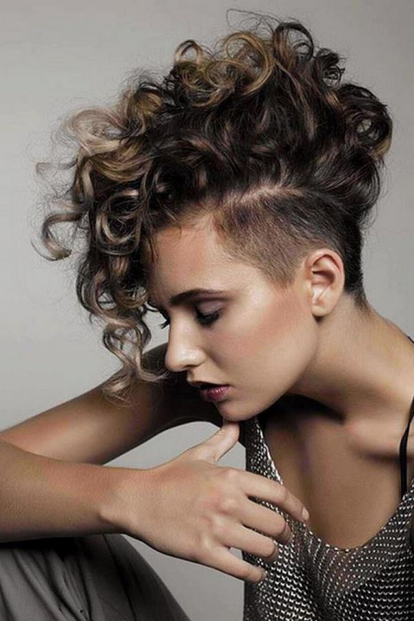short curly hairstyle with shaved side