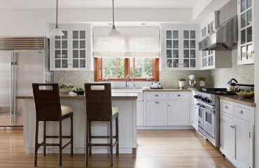 white-kitchen-design-glass-front-cabinets-breakfast-bar