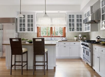 white-kitchen-design-glass-front-cabinets-breakfast-bar